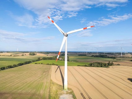 Wind turbine in a wind farm renewable energy wind power wind energy on the Baltic Sea aerial view