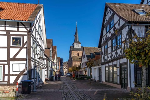 Half-timbered houses in the old town and the Protestant town church of St Nicolai in Bodenwerder,