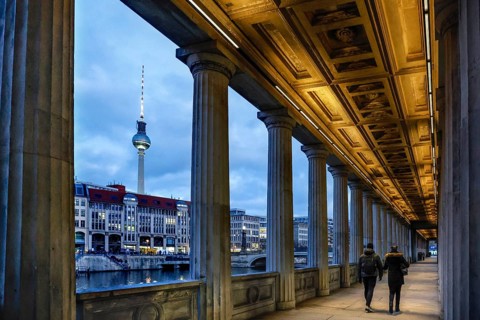Illuminated arcade at the old National Gallery, view of the Spree and the television tower, Berlin,