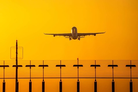 Aircraft taking off from the main runway south, 05R/23L, runway lighting, approach aids, at