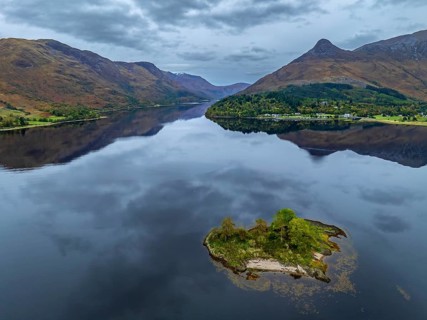 Mountains reflected in fjord, coast, island, autumn, cloudy, aerial view, Loch Leven, view of
