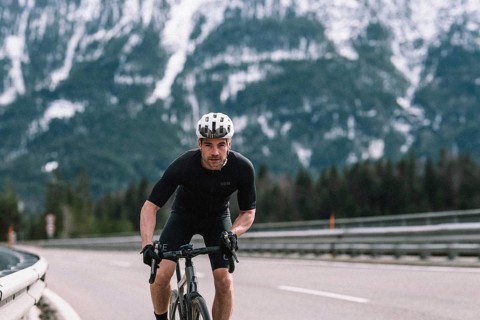 Road bike rider in spring between Lechtal and Tannheimer Tal in front of picturesque scenery of the