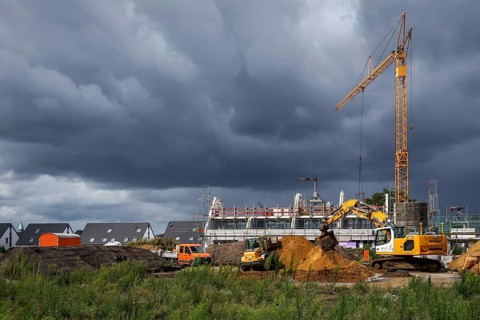 Bottrop, North Rhine-Westphalia, Germany, Housing construction in new development area. Dark clouds
