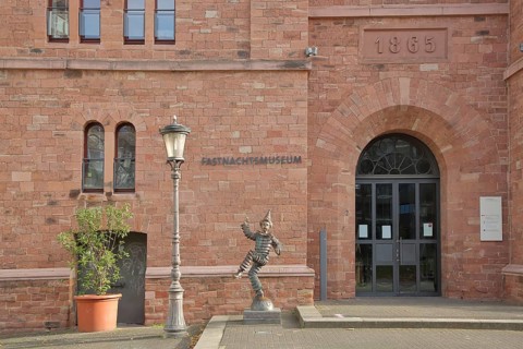 Entrance to the carnival museum, with sculpture of the Mainz Klepper-Garde, jester, dancing, merry,