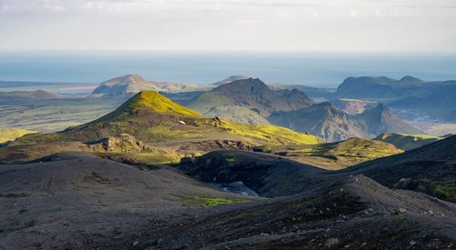 Volcanic mountain landscape overgrown with moss, atmospheric mountain landscape in the evening