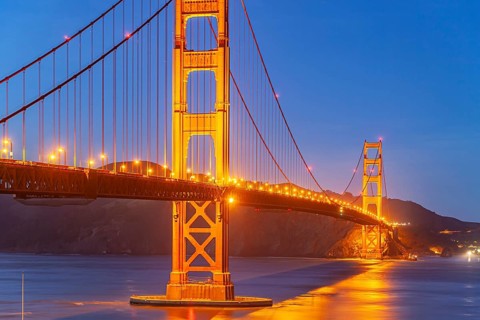 The illuminated Golden Gate Bridge in San Francisco at dusk, California, United States of America,