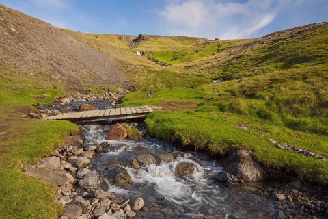 Flowing water below the waterfall. Hengifoss waterfall is located in Hengifossá in