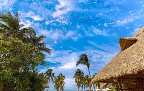 Serene turquoise Isla Mujeres beach Playa Norte famous for emerald waters, sandy sea shore and