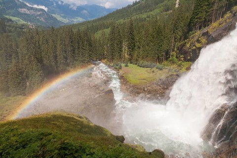 Krimml Waterfalls with rainbow. They have a total height of 380 metres (1, 247 feet) and are the
