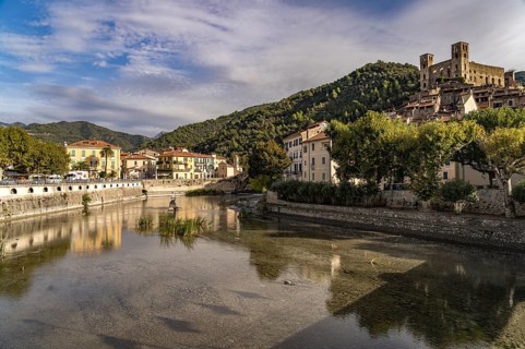 Town view with the Nervia river and the Castello dei Doria castle in Dolceacqua, Liguria, Italy,