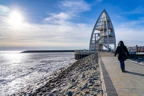 The East Frisian North Sea island of Juist in winter, Juist pier, Juist lookout tower, frozen coast