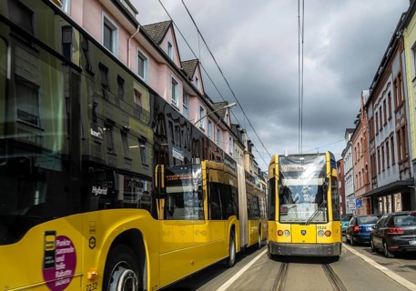 Tram and bus in traffic, on the street Schonnebeckhöfe in Essen-Katernberg, North Rhine-Westphalia,