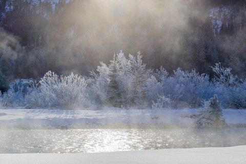 Isar valley in winter at temperatures of minus 18 degrees Celsius. Snow covered landscape with the