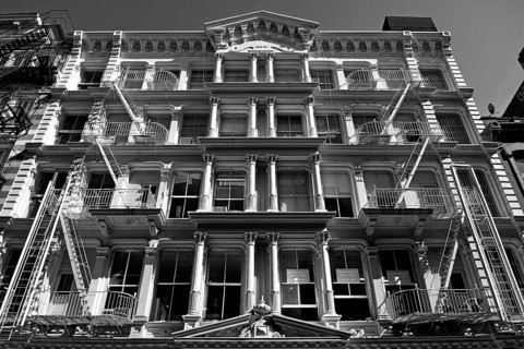 Neoclassical house facade with fire escapes, Downtown, New York City, USA, North America