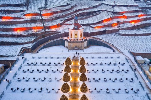 Aerial view of the Belvedere in Wackerbarth Castle Park with vineyards under snow and Christmas