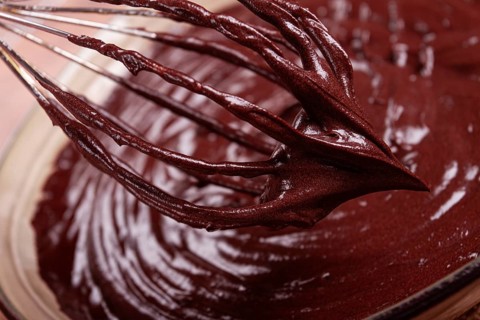 A bowl of chocolate dough, a whisk for whipping, baking, structure and consistency, homemade, top
