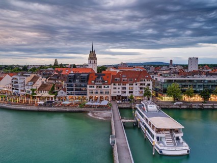 View from the Moleturm to the harbour of Friedrichshafen, ships, cloudy atmosphere at sunset, Lake