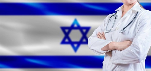 Doctor with crossed arms on Israel flag. Israeli Health and Care concept. Female doctor on Israel