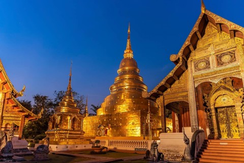 The Buddhist temple complex of Wat Phra Singh at dusk, Chiang Mai, Thailand, Asia