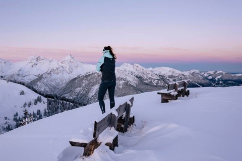 Hiking in the snow in the snow-covered winder landscape in the Alps at Neunerköpfle in the