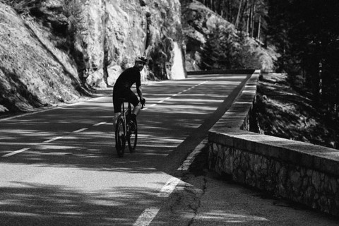 Road bike rider in spring between Lechtal and Tannheimer Tal in front of picturesque scenery of the