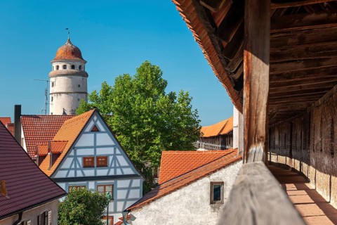 View from the battlements of the town wall to the tower of the Deininger Tor tor in the old town,
