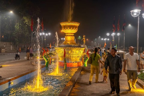 Illuminated fountain in Fountain Square Park in Luang Prabang, Laos, Asia