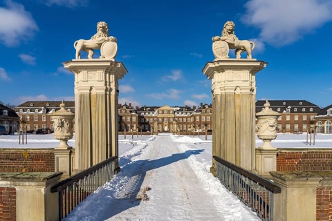 Portal to the snow-covered Nordkirchen Castle in winter, Nordkirchen, Münsterland, North