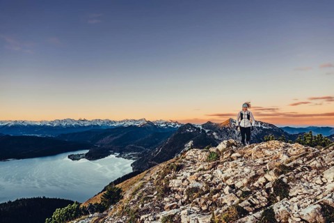 Trail running in autumn on the Jochberg on Lake Walchensee against the wonderful backdrop of the