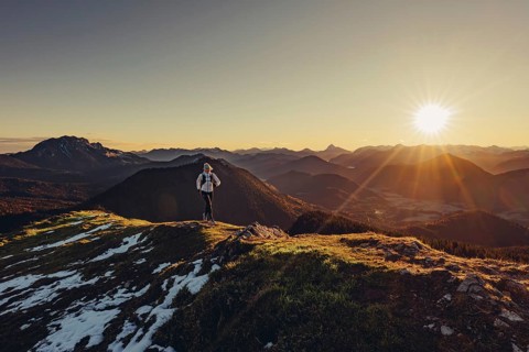 Trail running in autumn on the Jochberg on Lake Walchensee against the wonderful backdrop of the