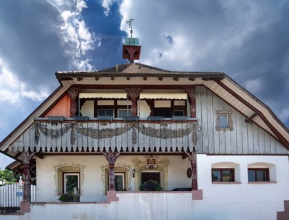 Former historic farmhouse with midday chimes, Riegel am Kaiserstuhl, Baden-Württembnerg, Germany,