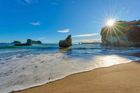 Rocky beach in clear weather with strong sunlight, Cathedral Cove, Coromandel, Canterbury, North