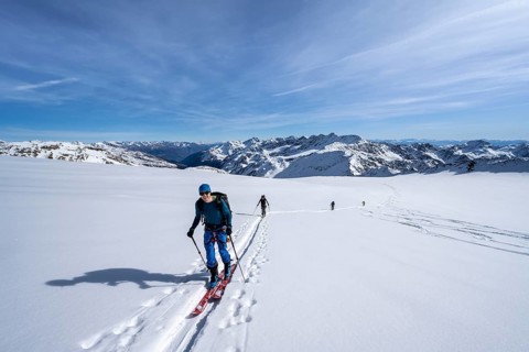 Ski tourers on an alpine tour on the Fürkeleferner glacier, snow-covered mountain landscape in