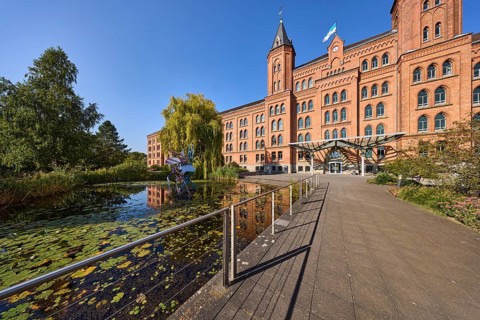 New town hall, brick architecture, architectural style neo-gothic, park, trees, footpath, pond,