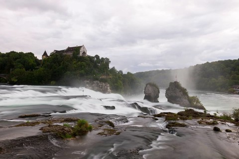 Epic flowing waterfall next to a castle on a clear background, Schloss Laufen, Rhine Falls, Canton