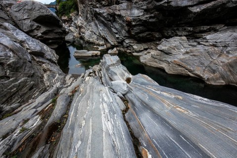 Rocks, granite rock formations in the Maggia River near Ponte Brolla, in the Maggia Valley, Valle