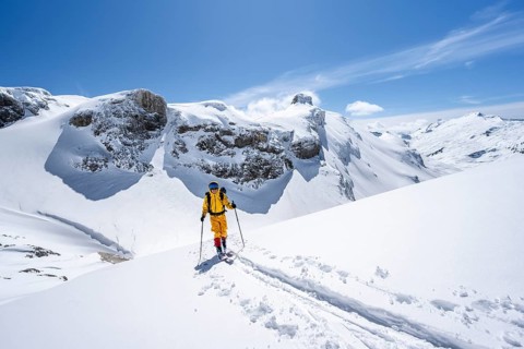Ski tourer in mountain landscape with snow, ascent to Wildstrubelhütte, Bernese Alps, Switzerland,