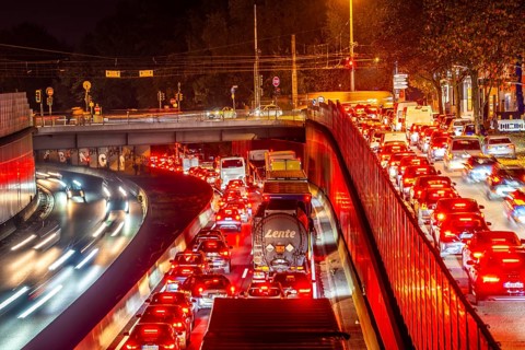 Evening traffic, partly with congestion, slow-moving traffic on the A40 motorway, traffic jam