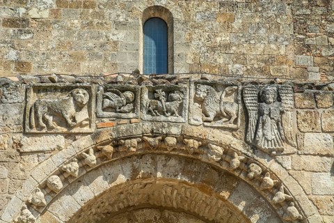 Old figures over the entrance to Minor Basilica and Sanctuary Maria SS. Regina di Anglona,