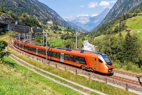 Railway passenger train of the type Stadler Flirt of the Südostbahn on the Gotthard railway in the
