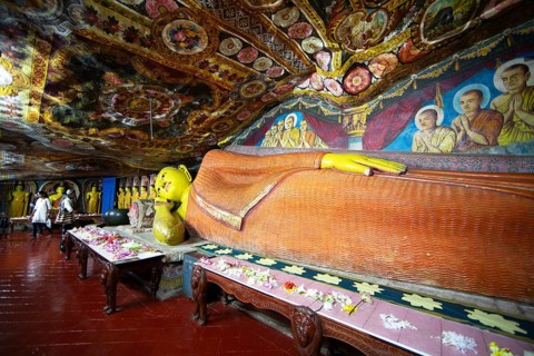 Reclining Buddha in Aluvihara Rock Cave Temple or Cave Monastery, Aluvihara, Matale, Central