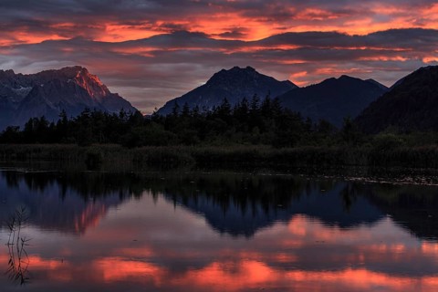 Mountains reflected in lake, sunset, cloudy mood, alpenglow, summer, seven springs, behind