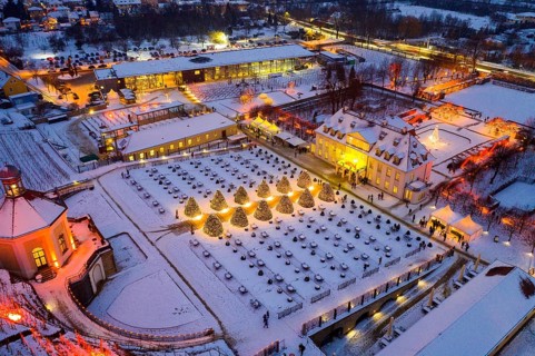Aerial view of Wackerbarth Castle with castle park, belvedere and vineyards with snow and Christmas