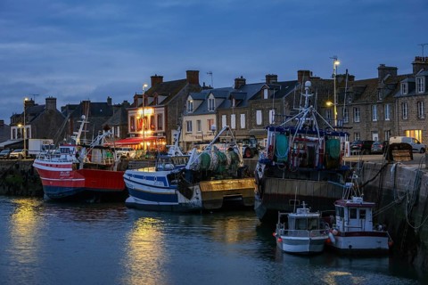Barfleur, Normandy, France - Fishing boats on the quay in the harbour of Barfleur, a picturesque