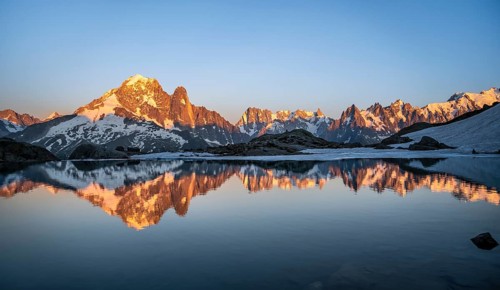 Evening mood, mountain landscape at sunset, alpenglow, water reflection in Lac Blanc, mountain