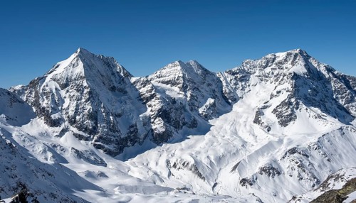 Snow-covered mountain landscape in winter, view of mountain peaks Königsspitze, Monte Zebru and