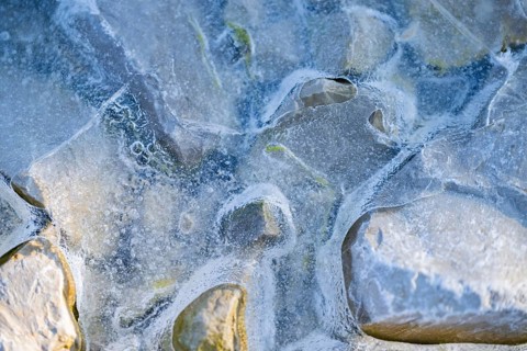 Close-up of stones in a frozen water, Bavaria, Germany, Europe