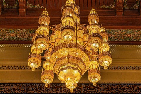 Illuminated chandelier in the Sultan Qaboos Mosque, Muscat, Arabian Peninsula, Sultanate of Oman