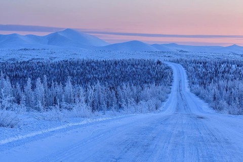 Snow-covered gravel road, highway, ice, snow, cold, mountain landscape, winter, morning mood,