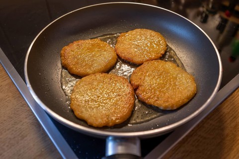 Freshly baked potato pancakes in the pan on the cooker, Bavaria, Germany, Europe